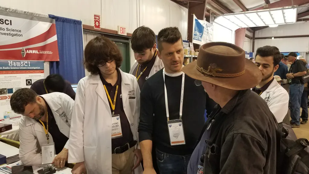 Brendan Keogan KD2LXD and Red Pitaya CEO Rok Mear demonstrate a Red Pitaya-based RBN Receive Node to a visiting ham.